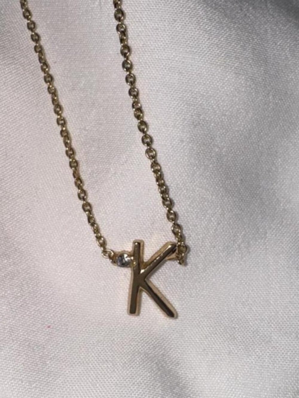Gold letter K necklace with diamond